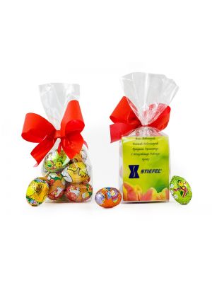 Clear foil gift bag with 6 flavoured mini eggs wrapped in Easter themed foil. Bag tied with a coloured ribbon and small personalised card inside. 
